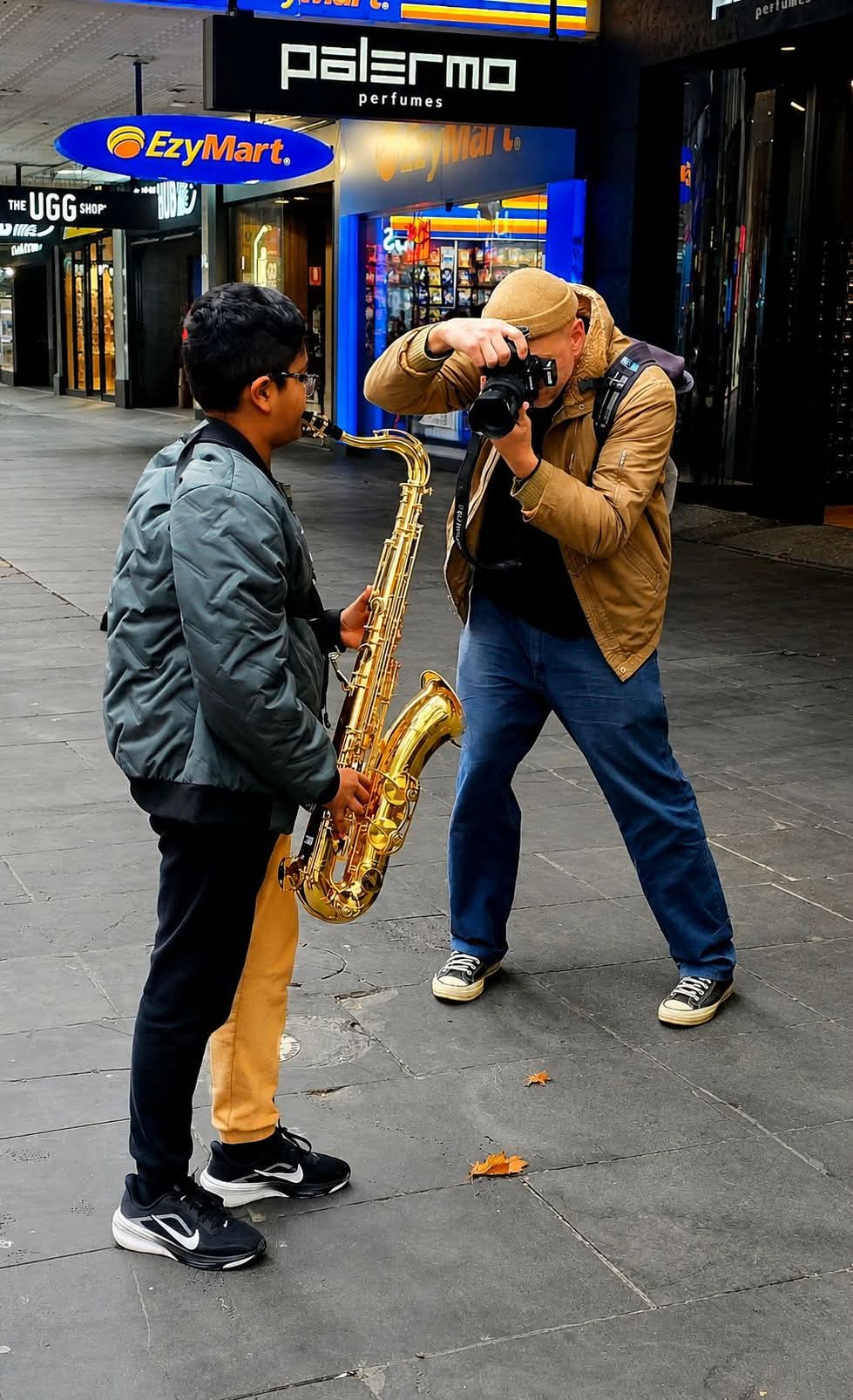 Ashane performing saxophone